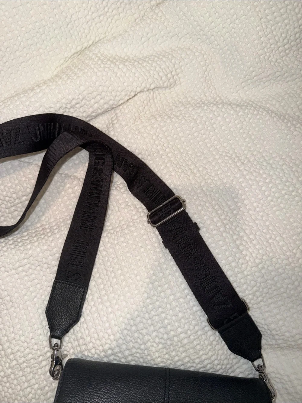 Black Leather Crossbody Bag with Silver Wing Emblem